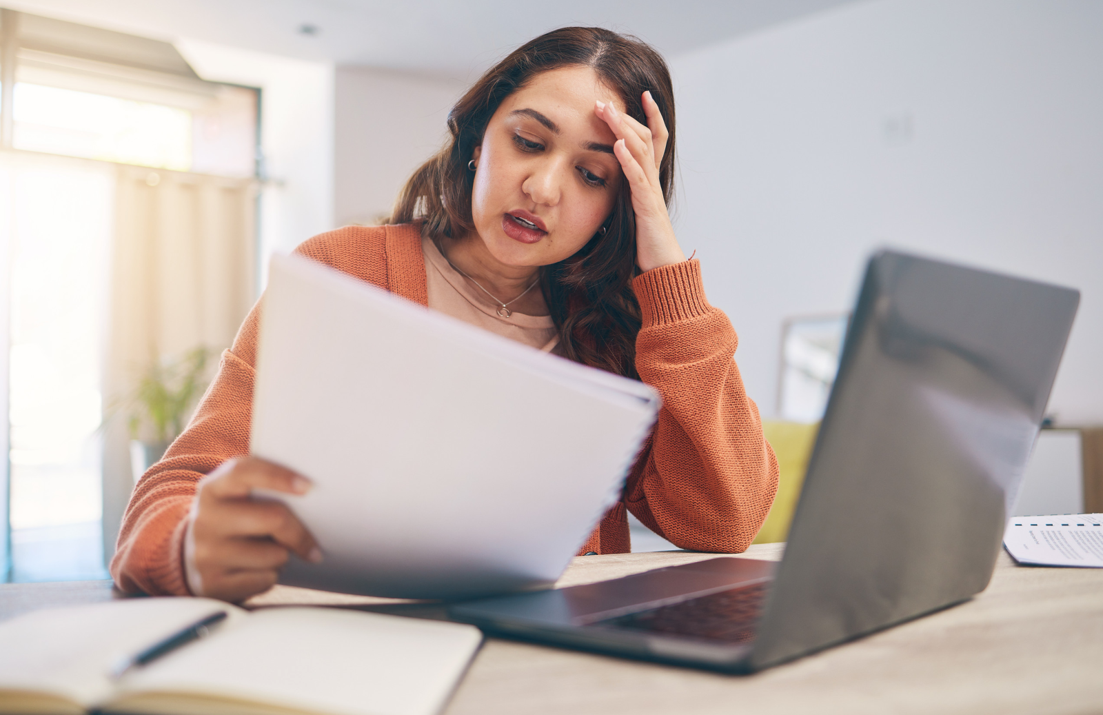 Stressed women holding documents