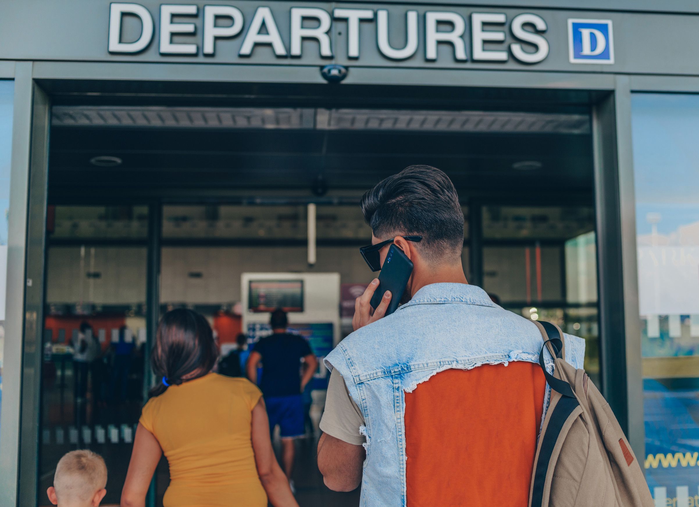 Passengers heading into airport departures